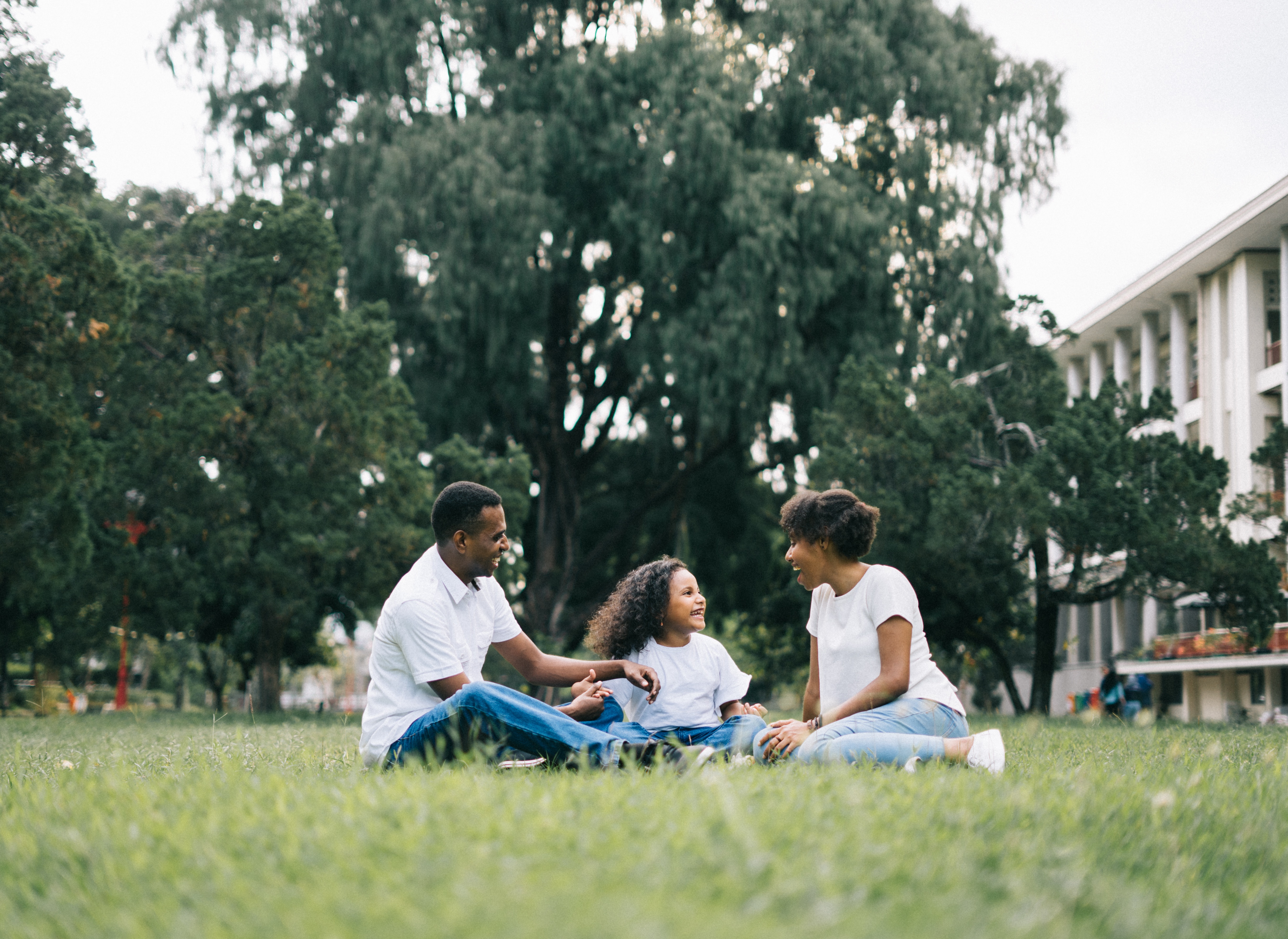 Family sitting in a yard